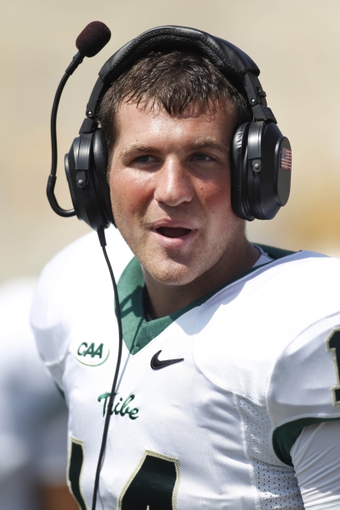 Aug 31, 2013; Morgantown, WV, USA; William &amp; Mary Tribe quarterback Christian Brumbaugh (14) reacts on the sidelines against the West Virginia Mountaineers ... - 7415428