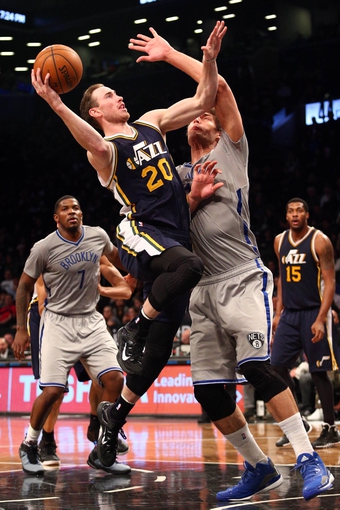 Mar 8, 2015; Brooklyn, NY, USA; Utah Jazz small forward Gordon Hayward (20) drives against Brooklyn Nets center Brook Lopez (11) during the third quarter at Barclays Center. The Jazz defeated the Nets 95-88. Mandatory Credit: Brad Penner-USA TODAY Sports
